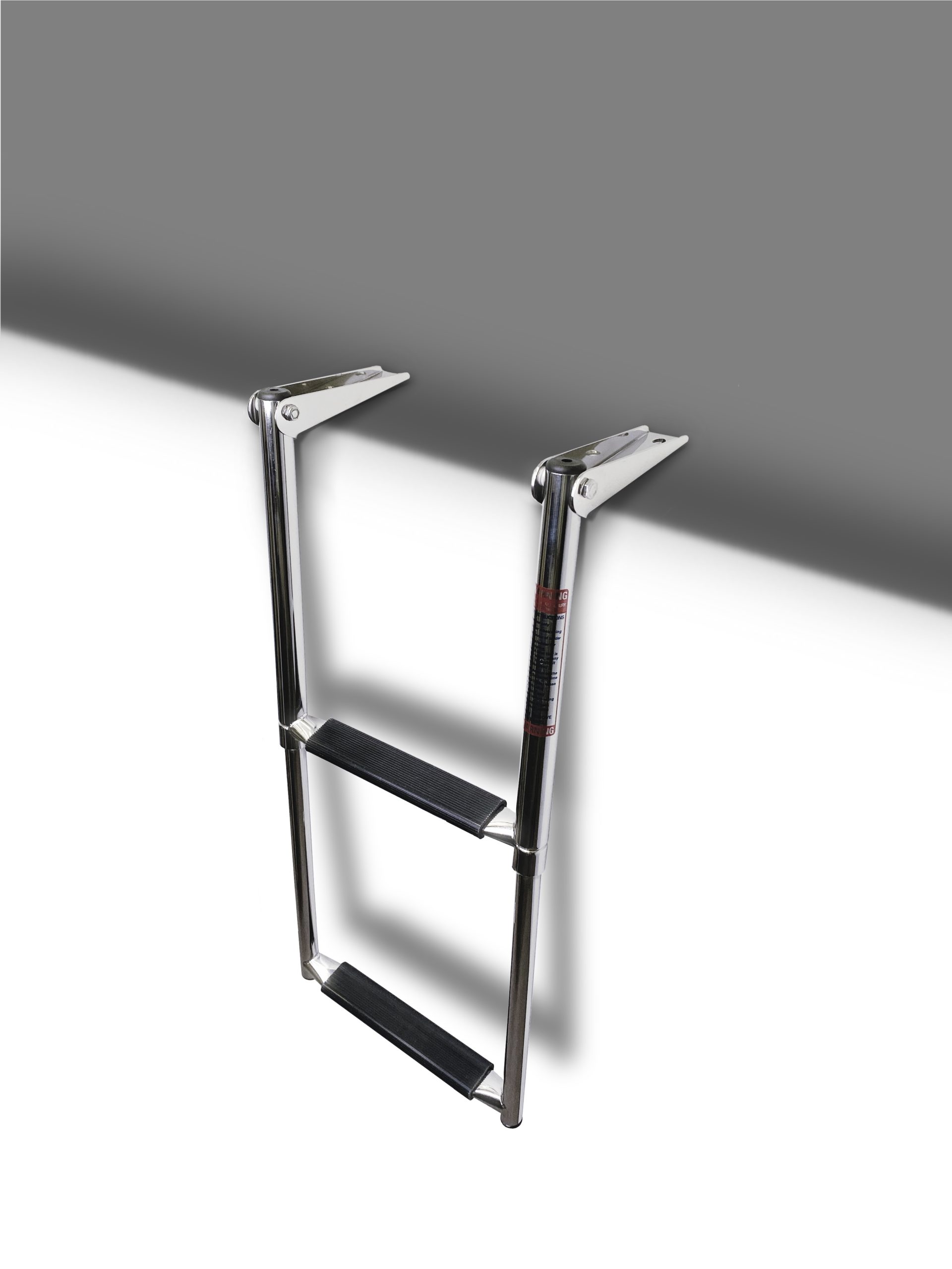 2-step over platform ladder, fully deployed and ready for use, demonstrating its sturdy stainless steel frame and practical design.